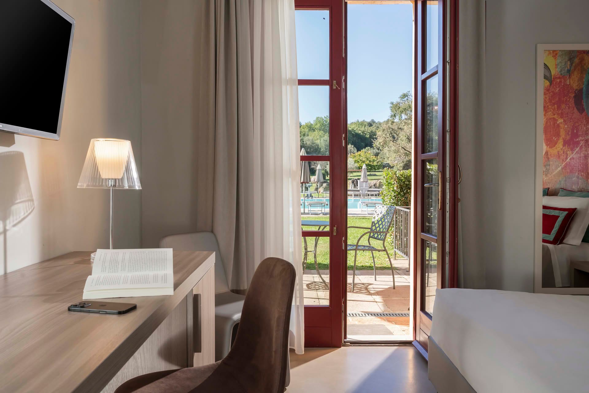 Detail of the view of the garden and pool from the Garden Room at Casolare Terre Rosse