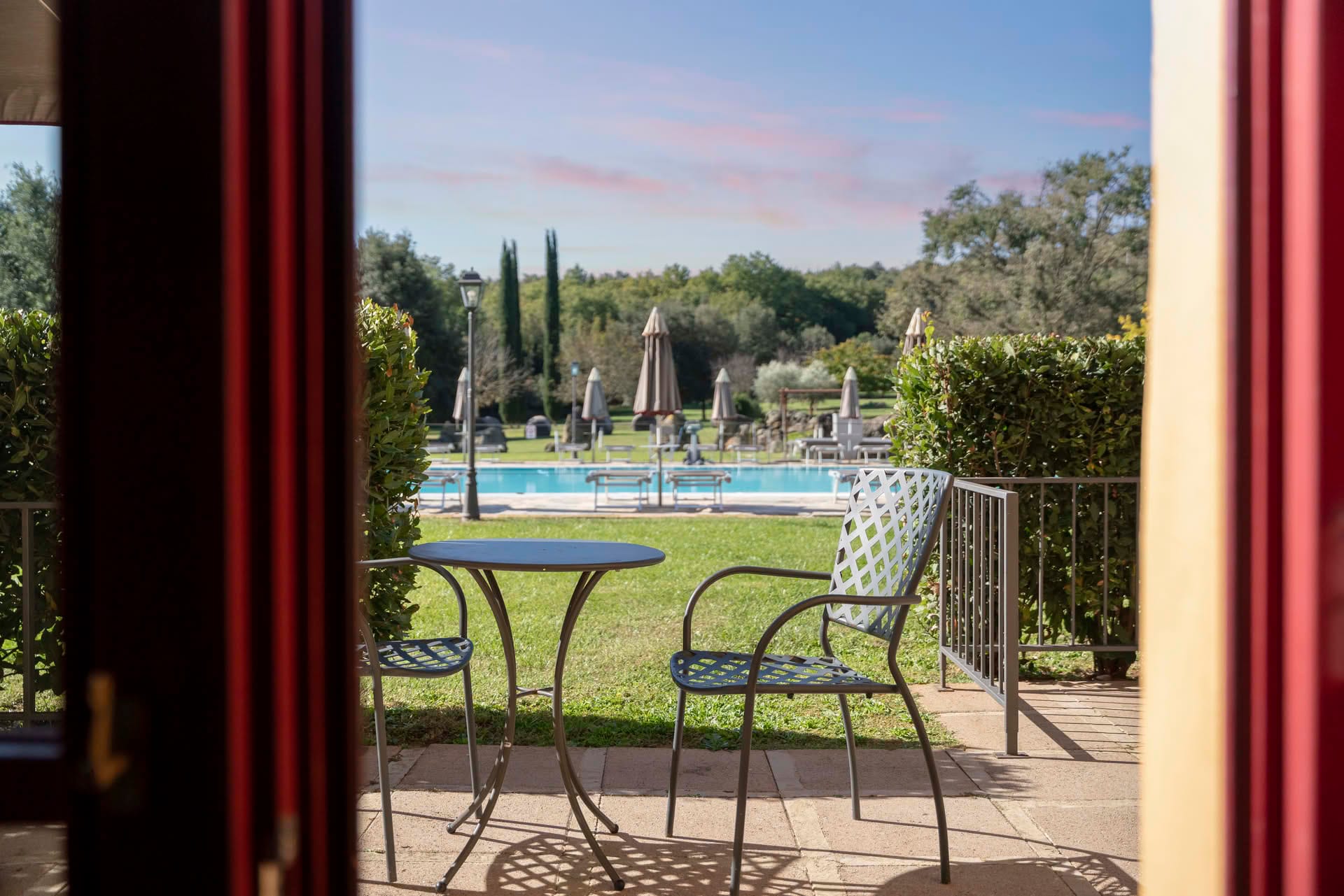Private outdoor space with small table and chairs in the garden