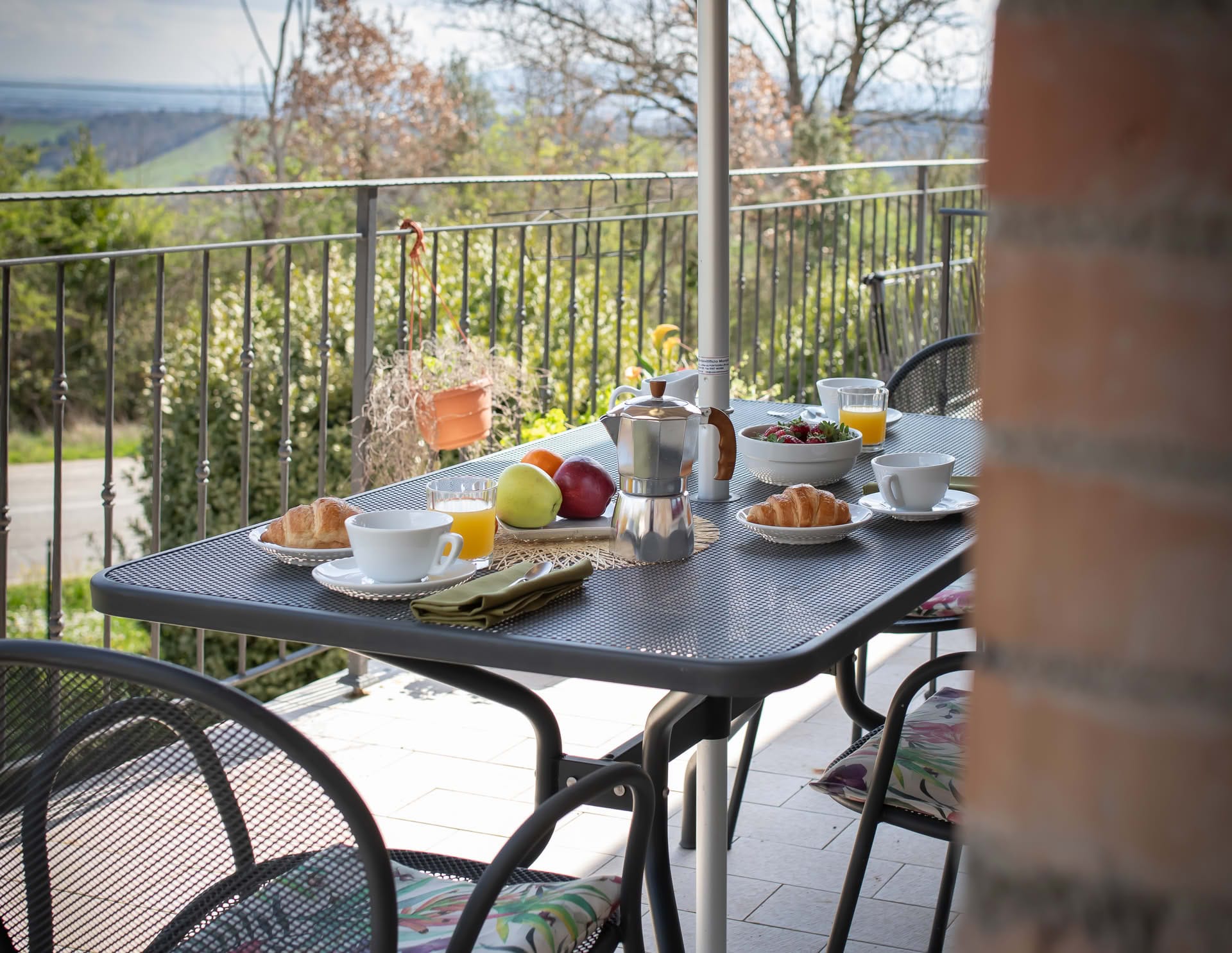 Breakfast served on the balcony of the Leccio Apartment