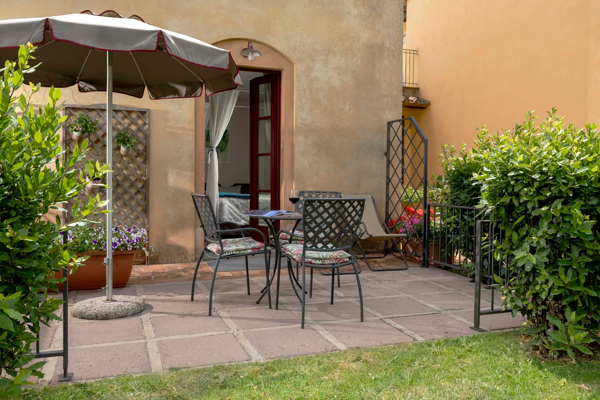 Private outdoor space with small table and chairs in the garden