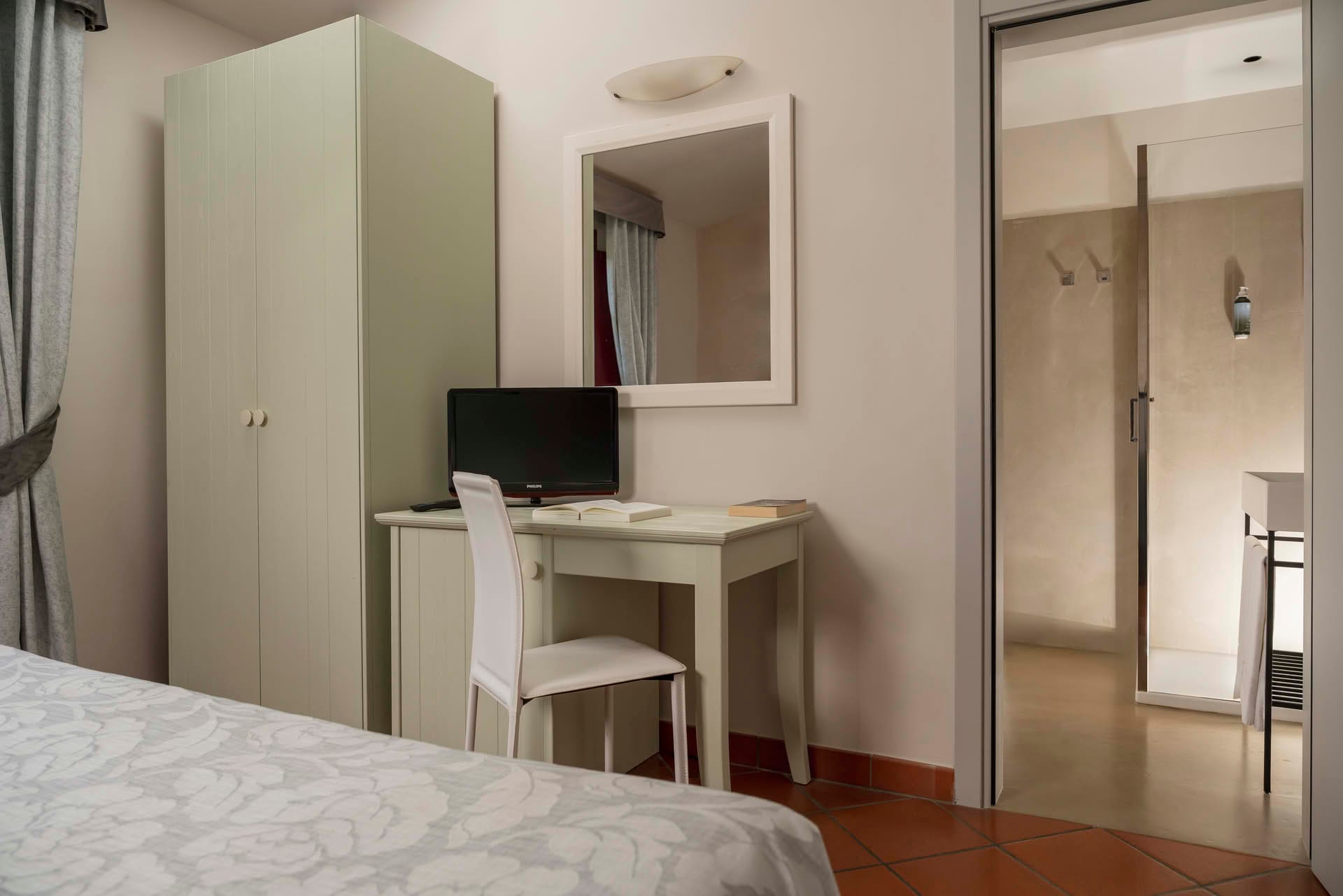 Detail of the desk with TV in the Suite at Casolare Terre Rosse