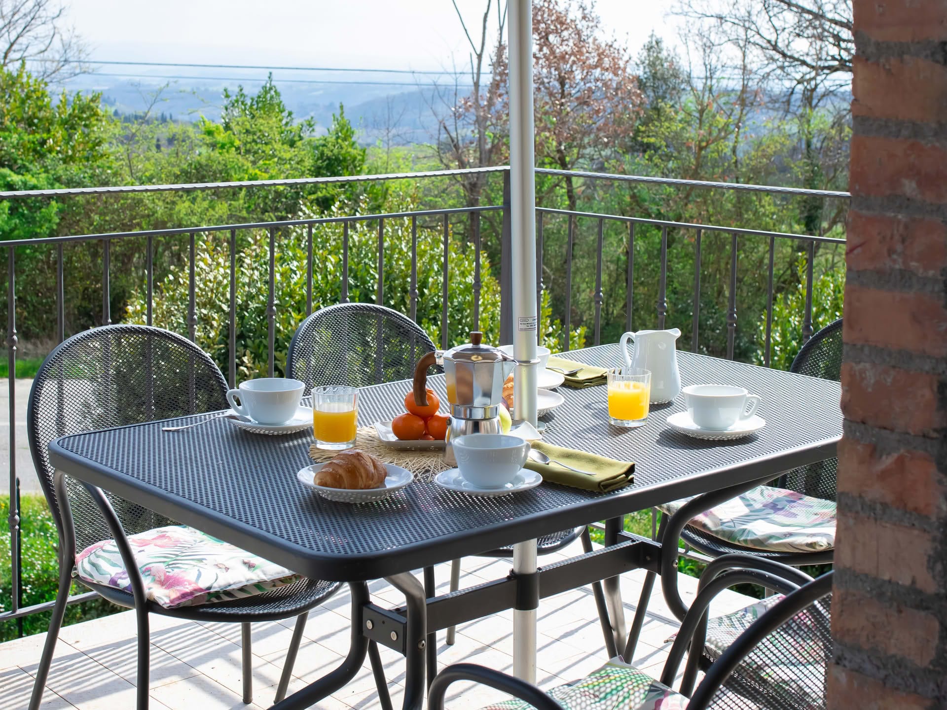 Breakfast served on the balcony of the Quercia Apartment