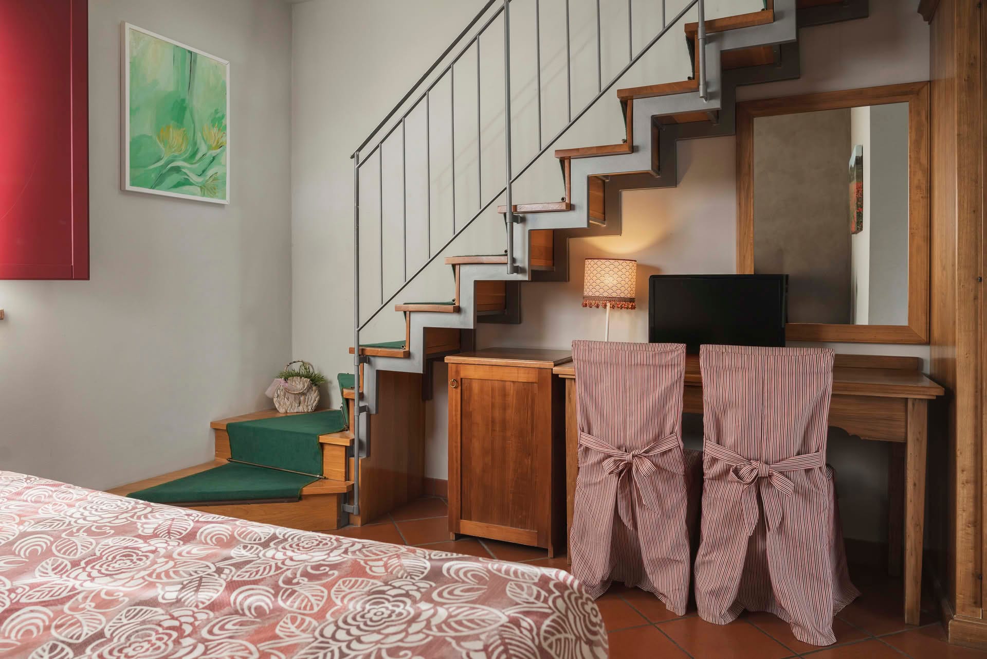 Detail of the desk in the Family Room and internal stairs leading to the upper floor
