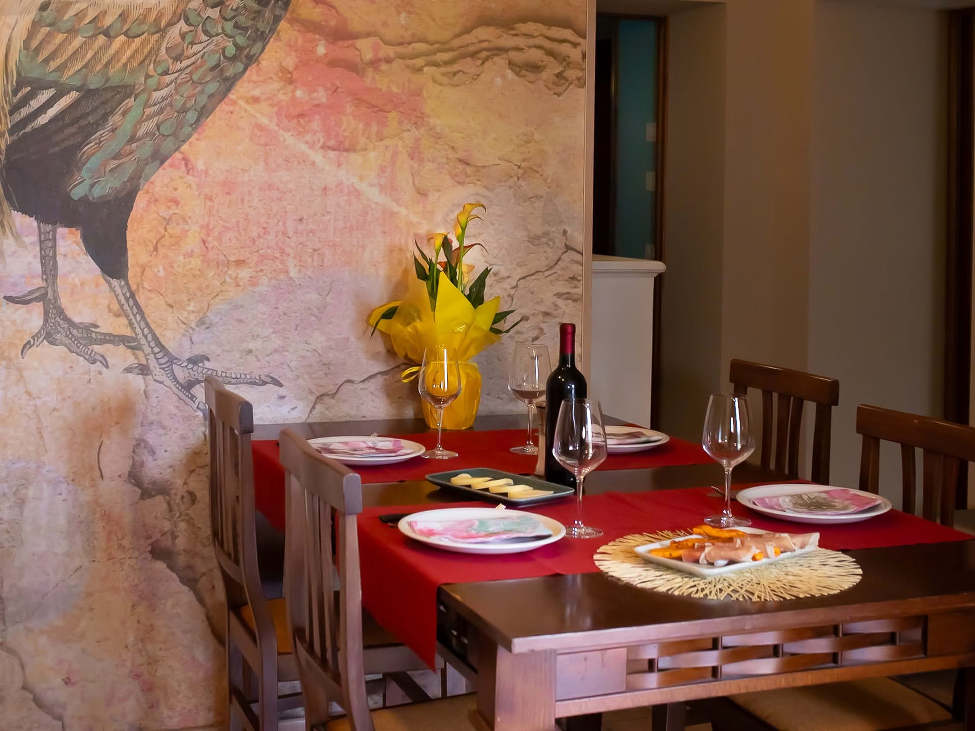Detail of the set dining table in the Olivo Apartment at Casolare Terre Rosse