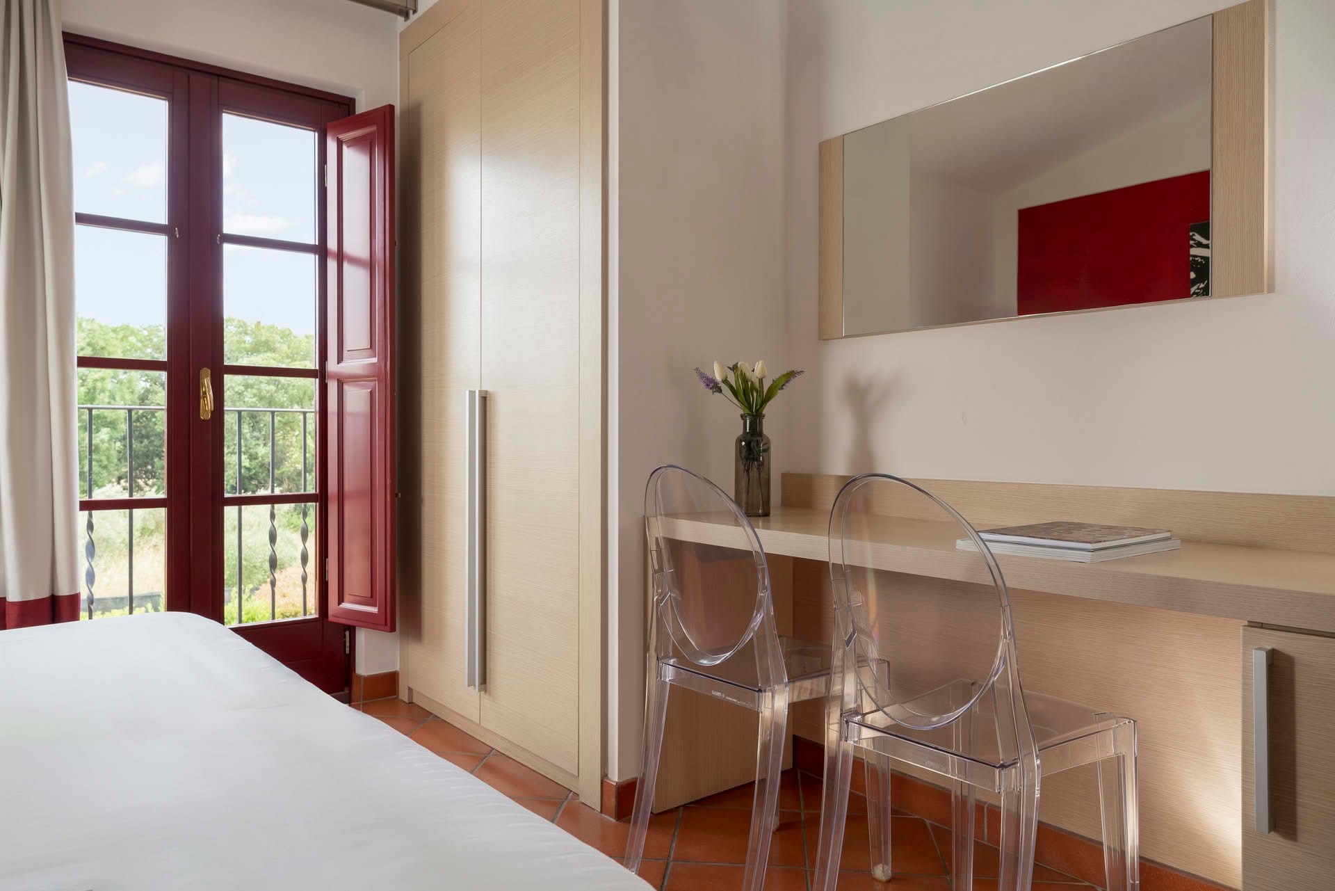 Detail of the desk with mirror and wardrobe in the Comfort Room at Casolare Terre Rosse