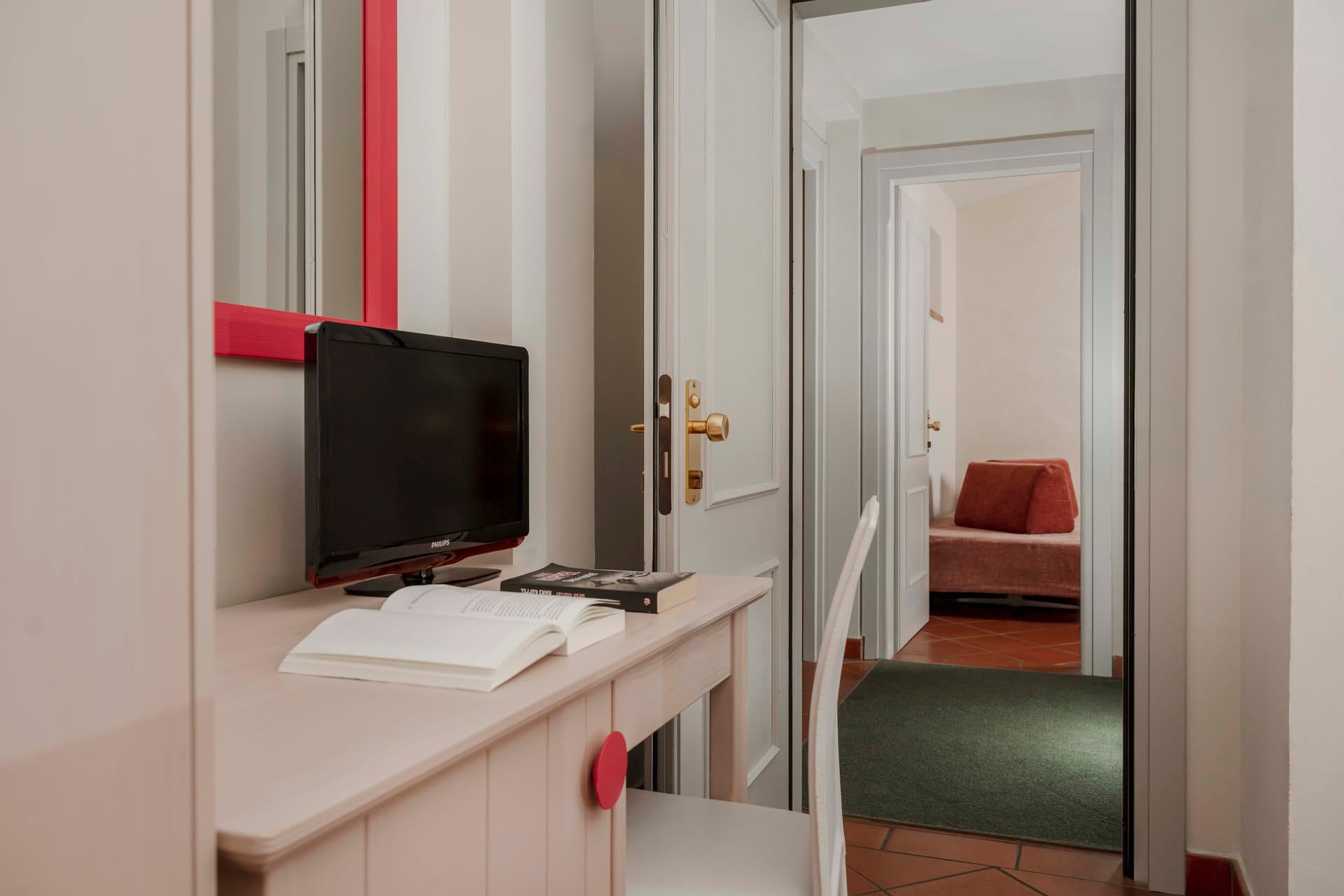Detail of the connecting rooms and desk with TV